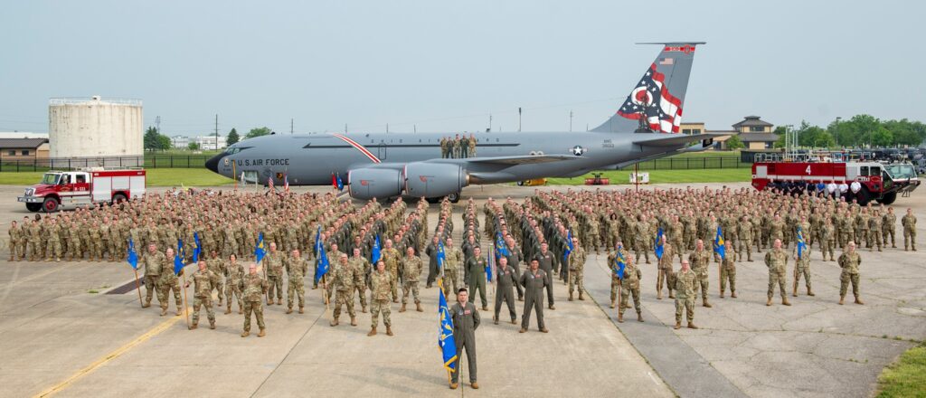 Ohio's refueling wing members standing in uniform in front of U.S. Air Force airplane.